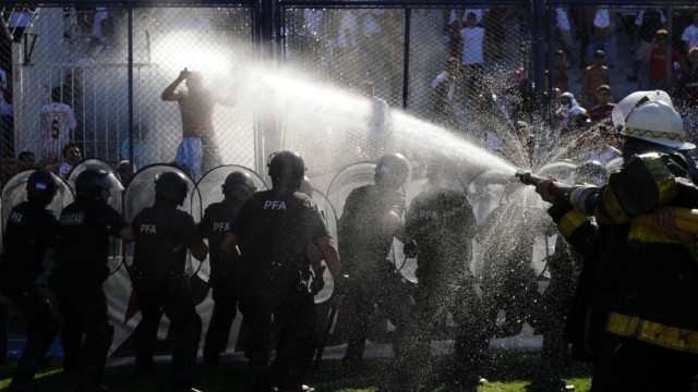 Argentine police hose down supporters of San Lorenzo de Almagro during clashes in Buenos Aires
