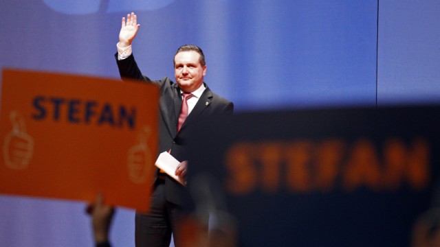 Mappus waves after his speech at an election campaign meeting in Ludwigsburg near Stuttgart