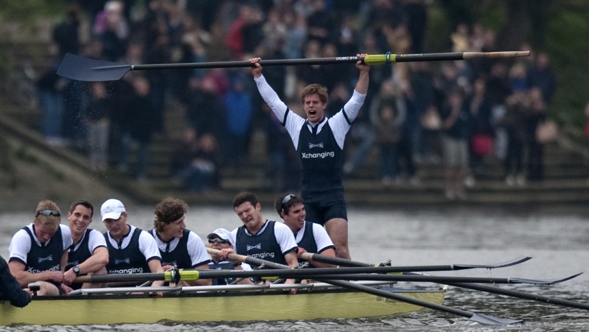 Moritz Hafner of Oxford stands up to celebrate defeating Cambridge in the 157th Boat Race on the River Thames in London
