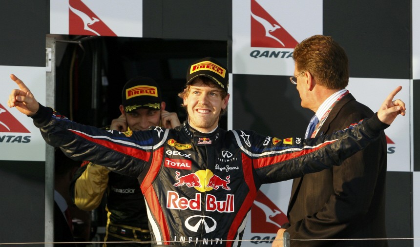 Red Bull Formula One driver Sebastian Vettel of Germany walks onto the podium after winning the Australian F1 Grand Prix at the Albert Park circuit in Melbourne