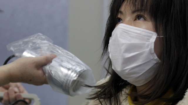 Imai, who was evacuated from Minamisoma in Fukushima, undergoes a test for signs of nuclear radiation at a health centre in Yonezawa, northern Japan