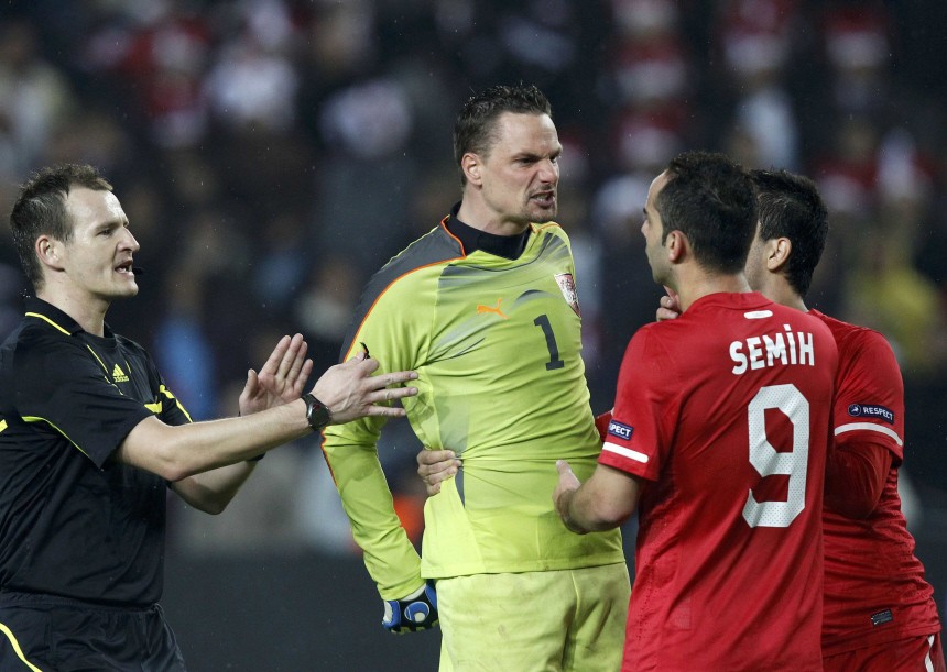 Austria's goalkeeper Macho argues with Turkey's  Senturk during their Euro 2012 Group A qualifying soccer match in Istanbul