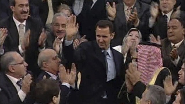 Video grab of Syrian President Bashar Al-Assad acknowledging applause before addressing the parliament in Damascus