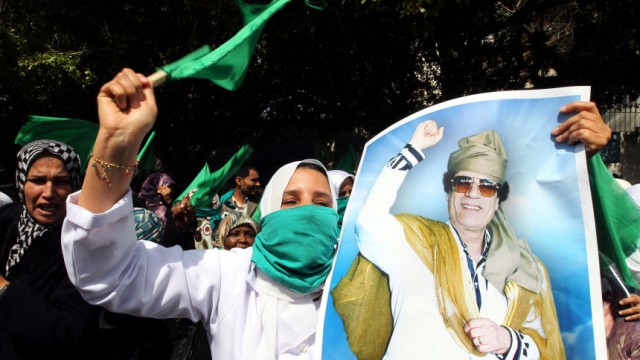Libyans loyal to leader Muammar Gaddafi demonstrate during a prot