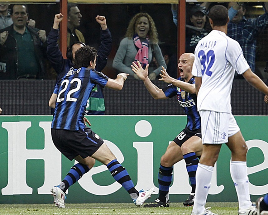 Inter Milan's Milito celebrates with Cambiasso after scoring against Schalke 04 during first leg of their Champions League quarter-final soccer match at the San Siro stadium in Milan