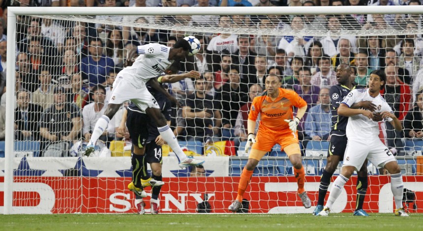Real Madrid's Adebayor heads the ball to score against Tottenham Hotspur during the first leg of their Champions League quarter-final soccer match in Madrid