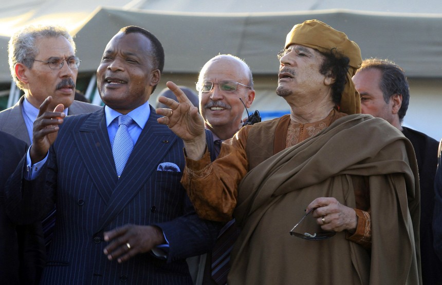 Libyan leader Muammar Gaddafi talks with Congo's President Denis Sassou Nguessou of as they stand for photograph outside a tent in Gaddafi's heavily fortified Bab al-Aziziya compound in Tripoli