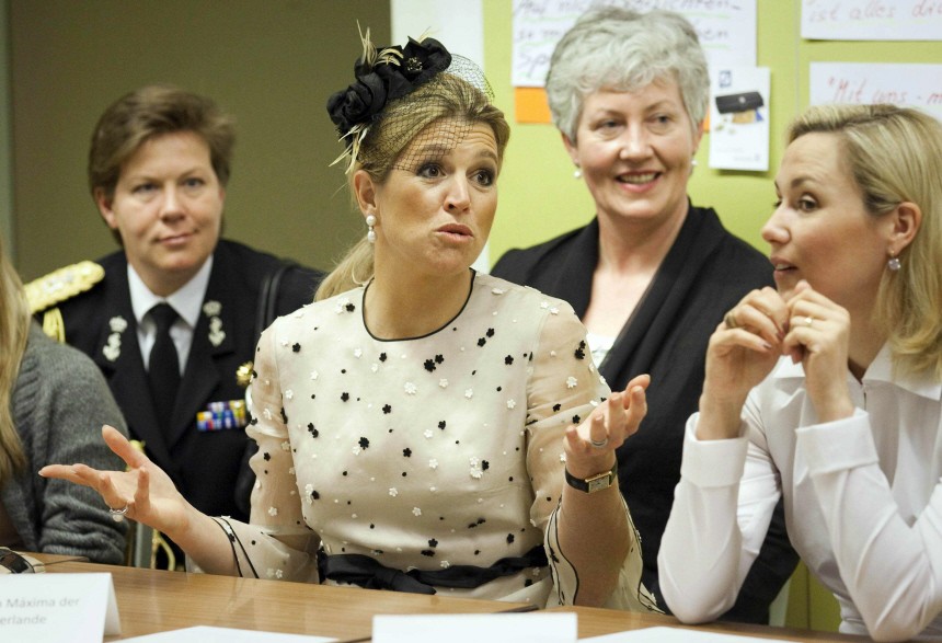 Princess Maxima of Netherlands and Bettina Wulff talk with students during visit to Friedensburg secondary school in Berlin