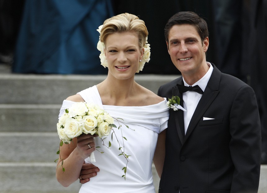 German Alpine ski racer Hoefl-Riesch and sports manager Hoefl leave church after wedding ceremony in Going