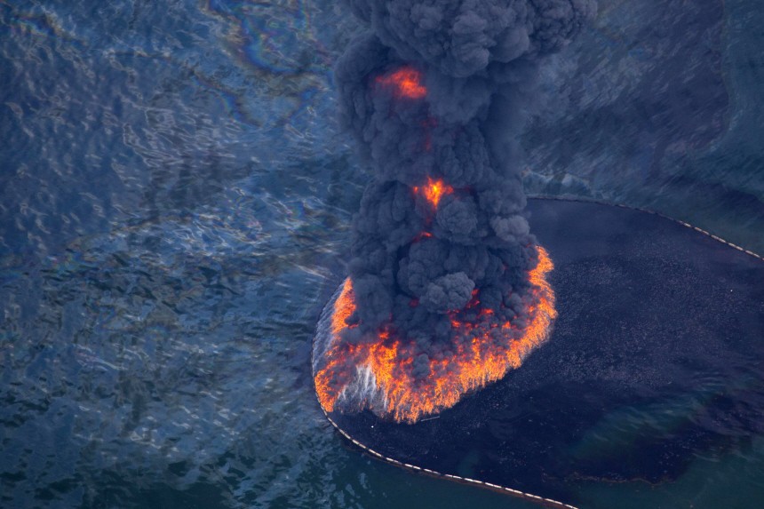 Fire and smoke rise from a controlled burn of oil on the surface of the Gulf of Mexico near BP's Deepwater Horizon spill source