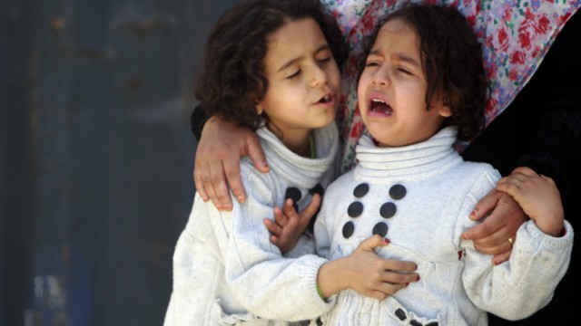 A Libyan girl, an evacuee, cries after arriving on a ship from Misrata during an evacuation operation at the port of Benghazi