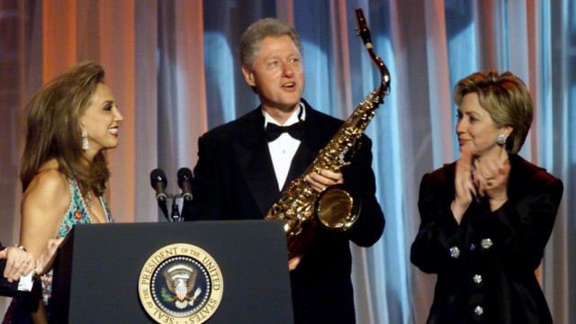 FILE PHOTO OF DENISE RICH PRESENTS BILL CLINTON WITH SAXAPHONE AT BENEFIT GALA IN NEW YORK