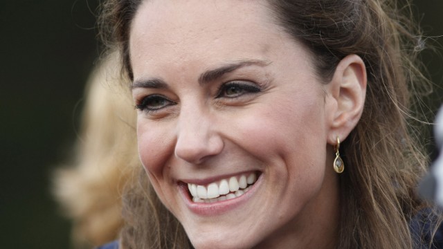 Kate Middleton, fiancee of Britain's Prince William, reacts to the crowd during a visit Witton Country Park in Darwen
