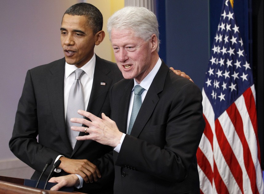 U.S. President Barack Obama joins former President Bill Clinton to speak to the media in the Brady Press Briefing Room at the White House in Washington