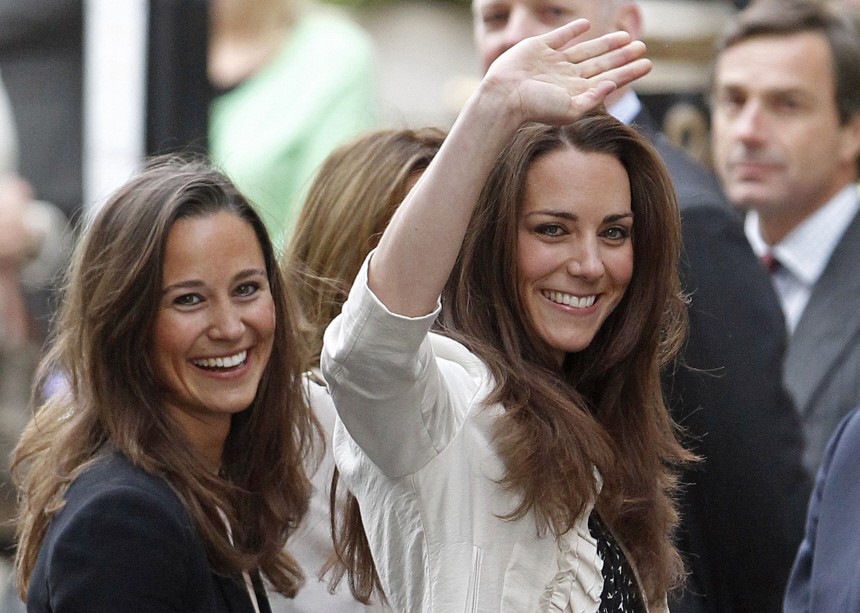 Kate Middleton, the fiancee of Britain's Prince William, waves as she arrives at The Goring hotel in London