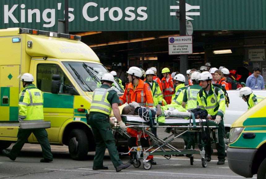 A casualty is taken away on a stretcher at London's King Cross station