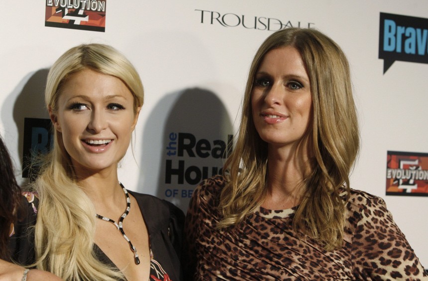 Sisters Paris and Nicky Hilton pose at the premiere party for Bravo's new reality series 'The Real Housewives of Beverly Hills' in Los Angeles