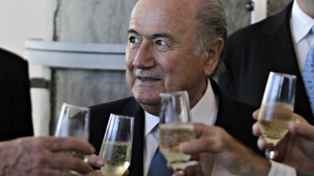FIFA President Sepp Blatter drinks a toast in Luque