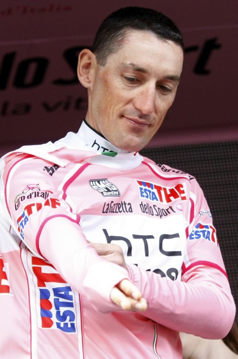 Pinotti wears the leader's pink jersey on the podium after the 19.3-km team time trial in Turin