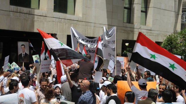 Syrians protest in front of the French embassy in Damascus