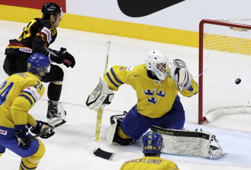 Germany's Barta scores past by Sweden's Kronwall and goaltender Fasth during their quarter-final match at the Ice Hockey World Championships in Bratislava