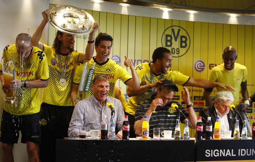 Dortmund's player celebrate wiht coach Klopp after winning the German soccer championship after their German Bundesliga soccer match against Frankfurt in Dortmund