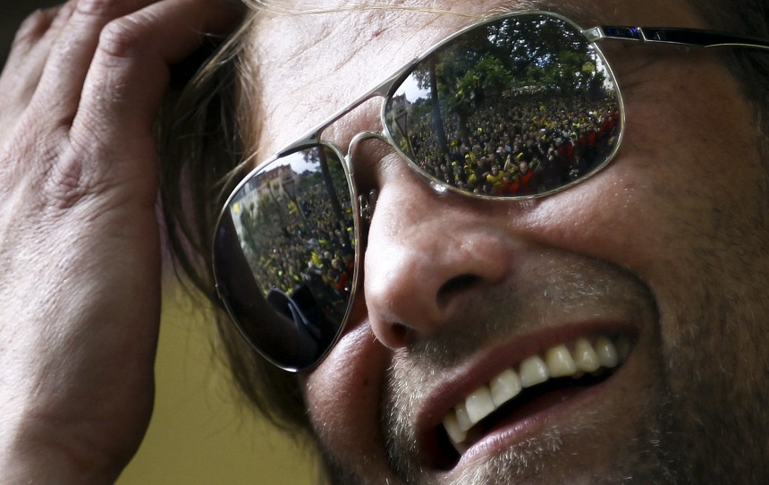 Juergen Klopp, coach of German soccer champion Borussia Dortmund cheers as he looks at tens of thousands of supporters of German soccer champion Borussia Dortmund during a parade through the streets of Dortmund