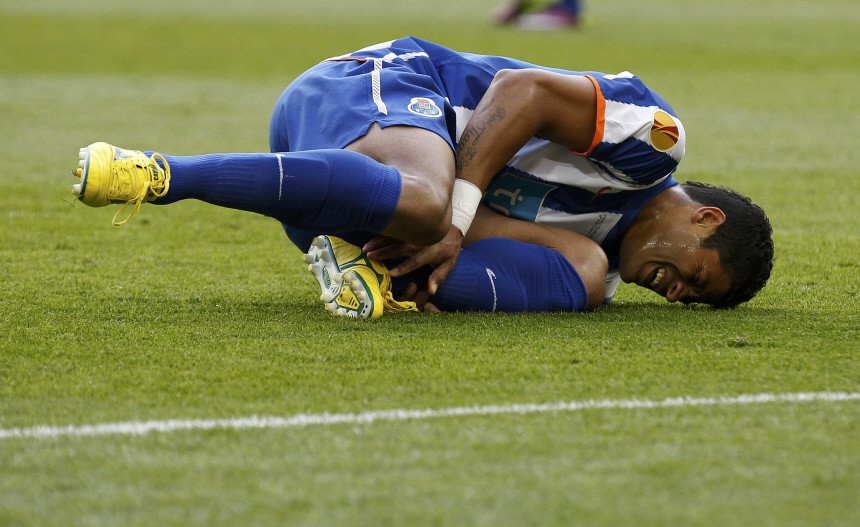 Porto's Hulk clutches his ankle after getting hurt during the Europa League final soccer match against Braga in Dublin