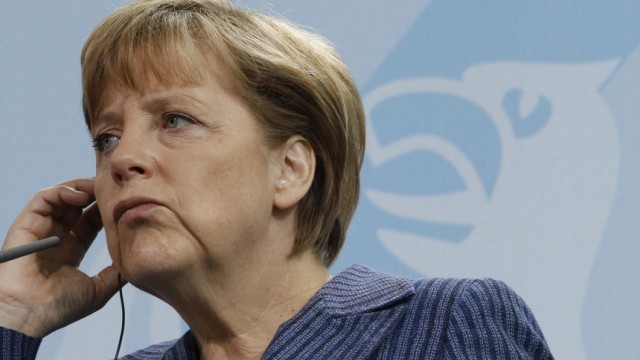 German Chancellor Merkel addresses news conference after talks in Berlin