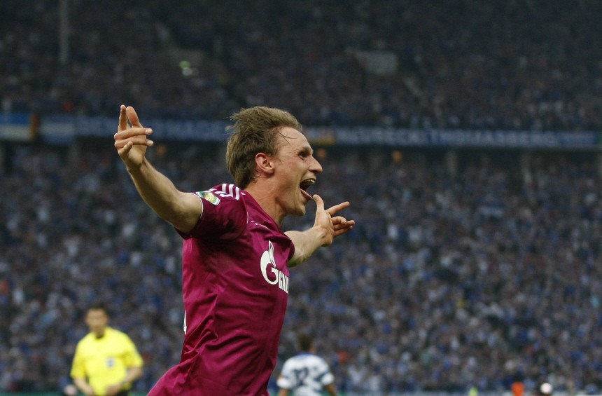 Schalke 04's Hoewedes celebrates a goal against MSV Duisburg during the German soccer cup final match in Berlin