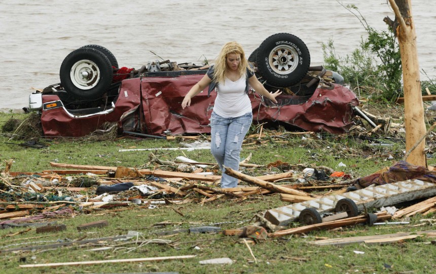 A woman participates in the search for missing children after a tornado ripped through the Falcon Lake area of Piedmont