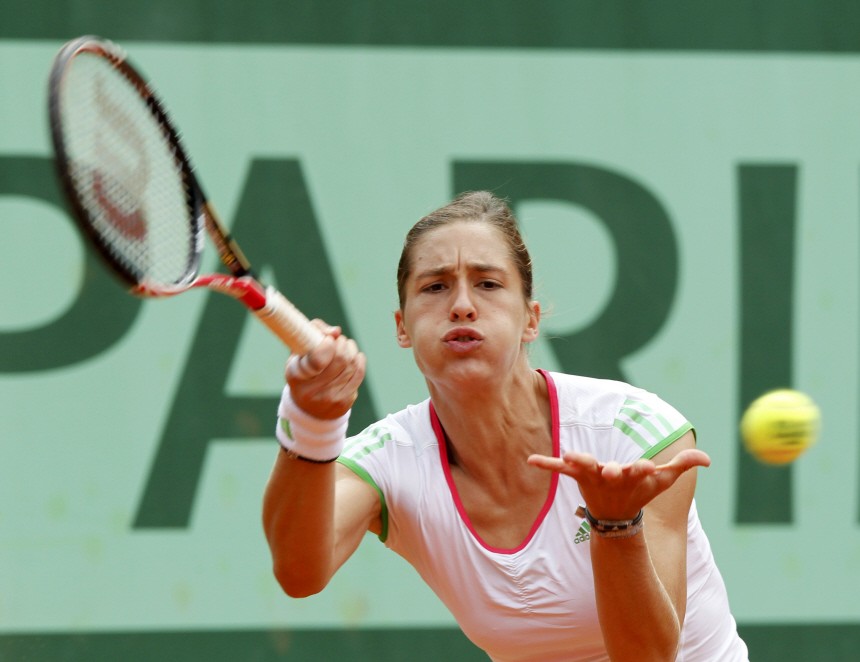 Petkovic of Germany returns the ball to Hradecka of the Czech Republic during the French Open tennis tournament at the Roland Garros stadium in Paris