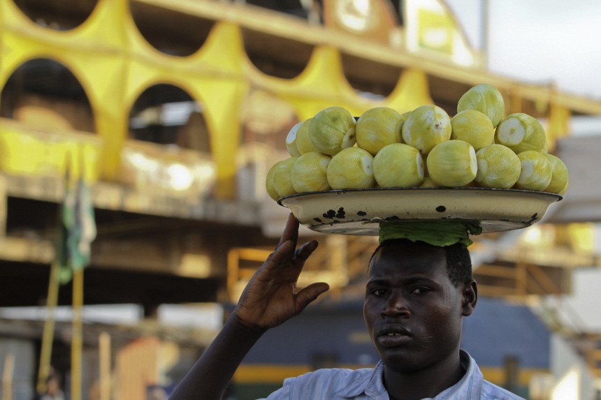 A man sells oranges near the main market in Nigeria's central city of Jos