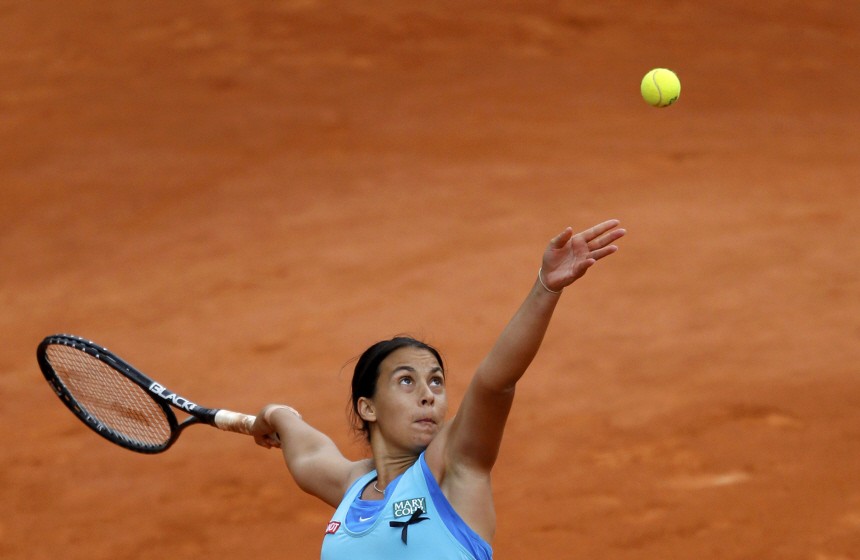 Bartoli of France serves to Goerges of Germany during the French Open tennis tournament at the Roland Garros stadium in Paris