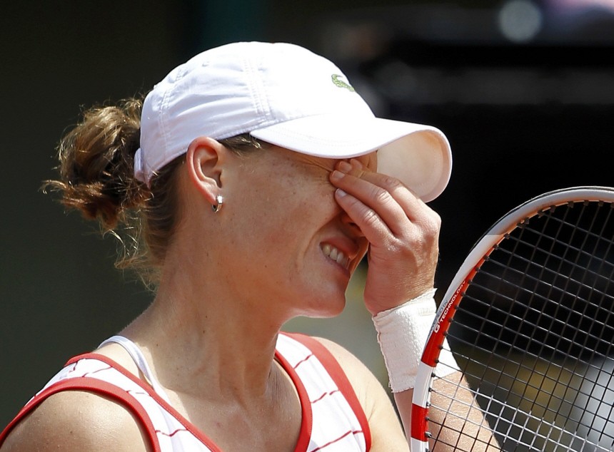 Stosur of Australia reacts during her match against Dulko of Argentina during the French Open tennis tournament at the Roland Garros stadium in Paris
