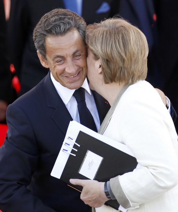 German Chancellor Merkel says goodbye to France's President Sarkozy at the end of the G8 summit meeting in Deauvill