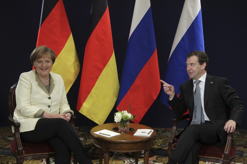 Russian President Medvedev meets with German Chancellor Merkel during the G8 summit in Deauville