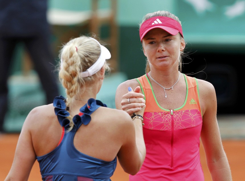 Hantuchova of Slovakia shakes hands with Wozniacki of Denmark after winning her match during the French Open tennis tournament at the Roland Garros stadium in Paris