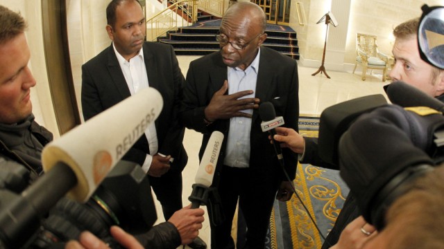Suspended FIFA executive member Warner talks to journalists at the lobby of a hotel in Zurich