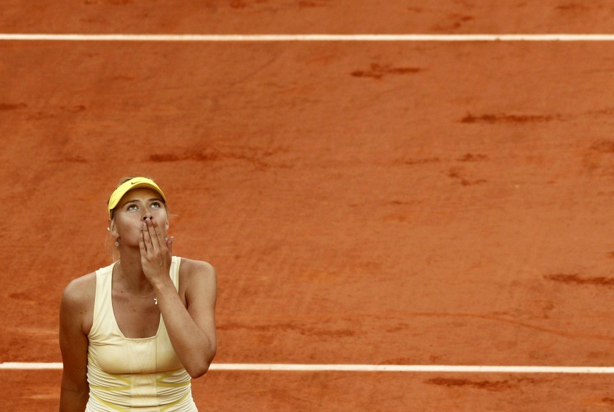 Sharapova of Russia reacts after winning her match against Radwanska of Poland during the French Open tennis tournament at the Roland Garros stadium in Paris
