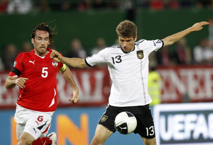 Austria's Fuchs challenges Germany's Mueller during their Euro 2012 Group A qualifying soccer match at the Ernst Happel stadium in Vienna
