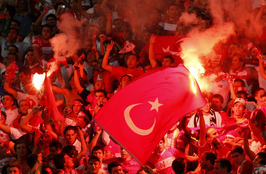 Turkey's supporters light flares during their Euro 2012 Group A qualifying soccer match against Belgium in Brussels