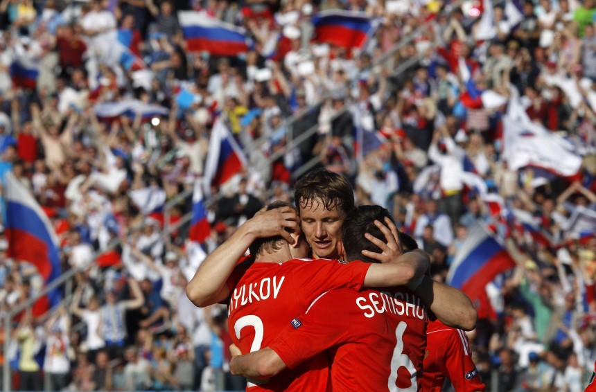 Russia's Anyukov, Pavlyuchenko and Semshov celebrate after scoring against Armenia during their Euro 2012 Group B qualifying soccer match in St. Petersburg