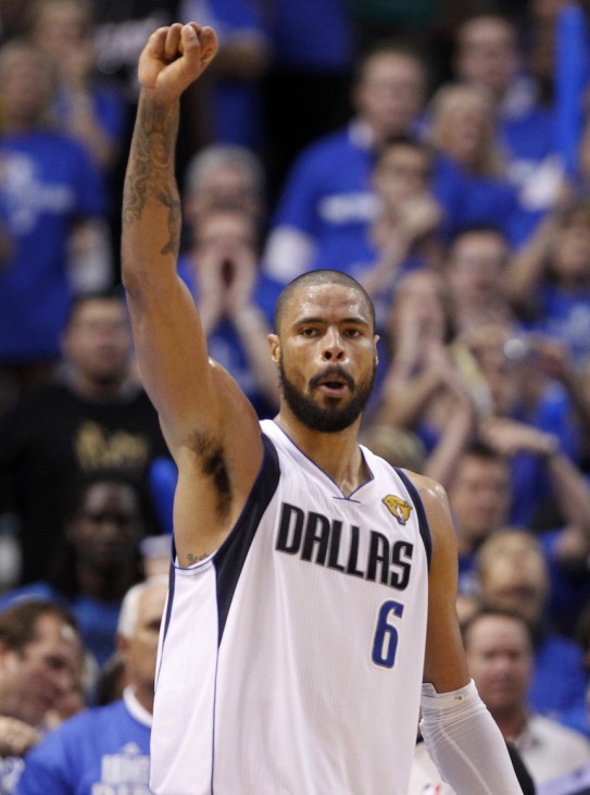 Dallas Mavericks' Tyson Chandler celebrates a basket against the Miami Heat during Game 4 of the NBA Finals basketball series in Dallas