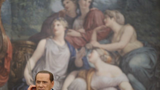 Italy's Prime Minister Berlusconi gestures during a news conference with his Israeli counterpart Netanyahu in Rome