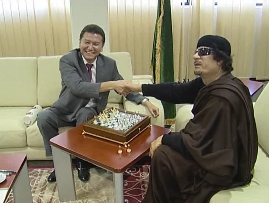 Libyan leader Muammar Gaddafi plays chess with FIDE President Kir