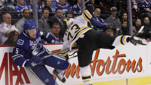 Bruins' Ryder collides with Canucks' Ehrhoff durng the first period of Game 2 of the NHL Stanley Cup hockey playoff in Vancouver