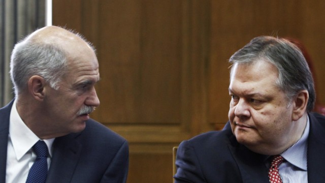 Greece's PM Papandreou talks with newly appointed Finance Minister Venizelos before a cabinet meeting at the parliament in Athens