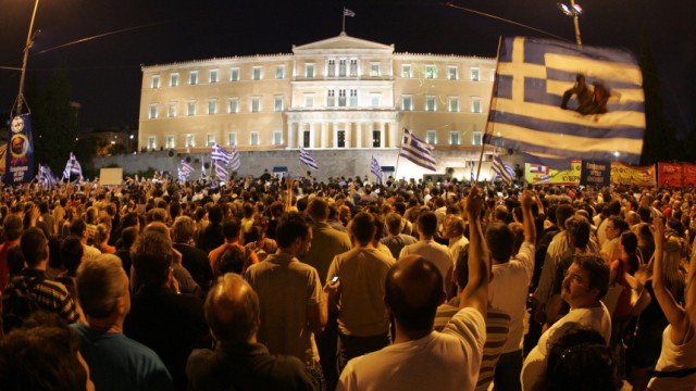 Citizens protest in front of the greek parliament building in Ath