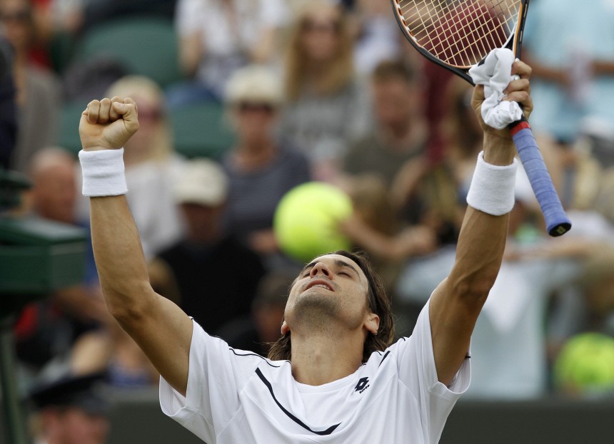 David Ferrer of Spain reacts after defeating Ryan Harrison of the U.S. at the Wimbledon tennis championships in London